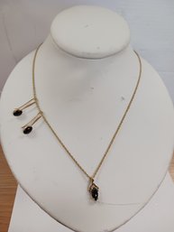 Golden And Black Necklace And Earrings