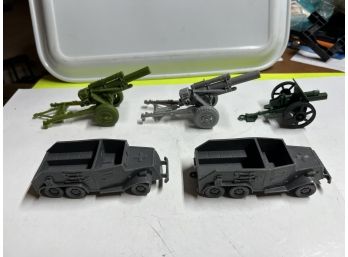 3 Plastic Cannons And Two Plastic Military Vehicles
