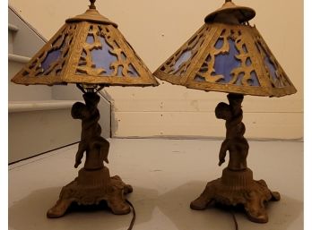 Pair Of Metal Cherub Lamps With Blue Slag Glass Shades