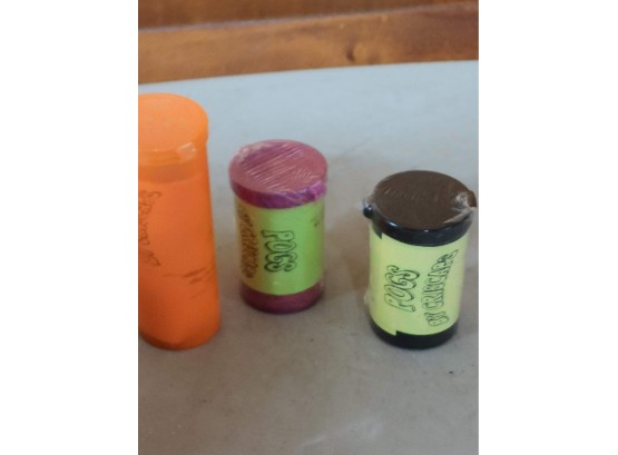 Two Sealed Criscaps Pogs Containers, With One Open