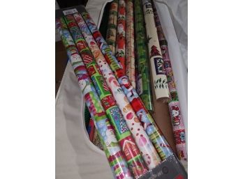 Wrapping Tub Full Of Many Sealed Rolls Of Christmas Paper