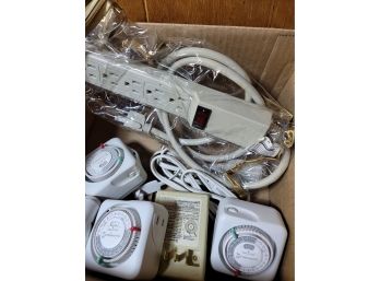 Box Of Extension Cords And Timers