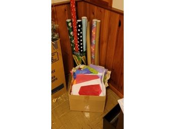 Open Rolls Of Wrapping Paper And A Box Of Tissue Paper