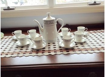 China Demitasse Set. Coffee Pot And 8 Cups And Saucers