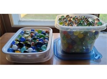 Two Containers Full Of Marbles