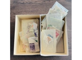 Box Of Collectible Stamps Separated In Small Envelopes