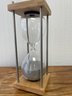 Contemporary HourglassTimer.  Stainless Frame,wood Top And Bottom