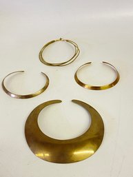 Four Assorted Brass Tone Necklaces