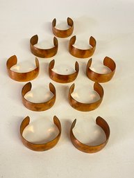Ten Rough Cut Copper Bracelets