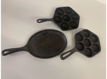 Three Cast Iron Pans, 2 Seven-cup Aebeleskiver Pans &  Oval  Skillet