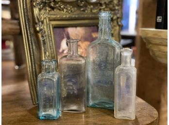 Set Of Four Antique Bottles