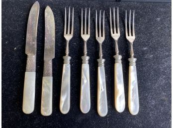 Two Pearly Handled Knives And 4 Small Forks
