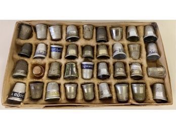 A Collection Of Advertising And Souvenir Thimbles