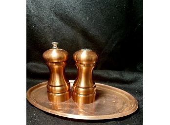 Copper Oval Platter With Salt And Pepper Shakers.