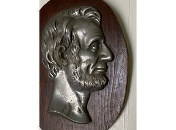 Vintage Metal Cast Of Lincoln Mounted On Old Oval Wood Plaque