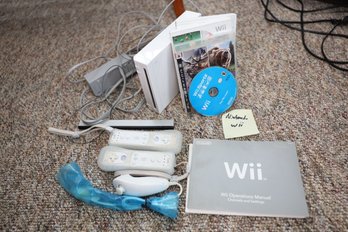 LOT 133 - NINTENDO WII AND GAMES AND CONTROLLERS