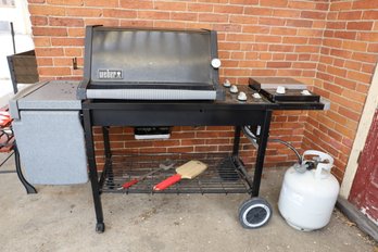 LOT 245 - WEBBER GRILL WITH COVER AND TANK ON PORCH