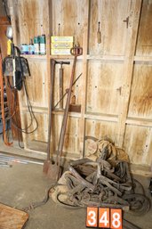 LOT 348 - HORSE TACK AND ITEMS AGAINST WALL IN PHOTOS