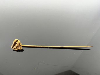 LOT 63 - GOLD NUGGET PIN - (NUGGET IS GOLD - PIN ITSELF UNKNOWN)