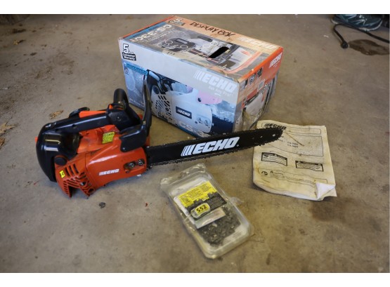 ECHO CHAINSAW WITH BOX AND PAPERWORK