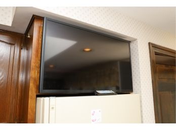TV AND MOUNT IN KITCHEN - BUYER TO SAFELY REMOVE