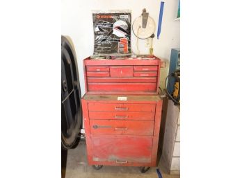 CORNWELL RED TOOL CHEST WITH ITEM IN IT AND ABOVE IT ON THE WALL