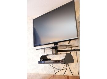 TV WITH WALL MOUNT AND DVD PLAYER - BUYER TO SAFELY REMOVE