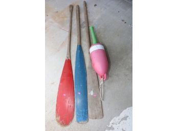 WOODEN PADDLES AND BUOY MARKED 107