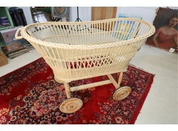 ANTIQUE BABY BASSENT WITH WHEELS MARKED 5