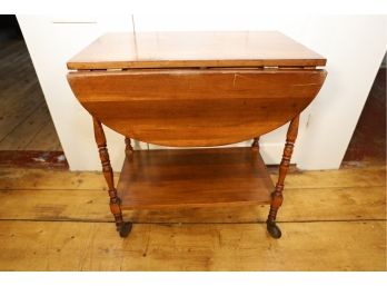 UNIQUE VINTAGE DROP LEAF TABLE WITH ROUND METAL WHEELS - MARKED 65