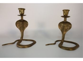 LOT 40 - TWO COBRA BRASS CANDLE HOLDERS