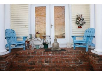 TWO BLUE CHAIRS / BUDDA STATUE / TABLE  PLANT POTS AND EVERTHING ON BRICKS BETWEEN BLUE CHAIRS