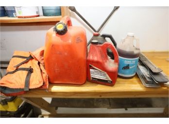 GAS CANS, CHAPS, CHAIN OIL, AND MISC LOT