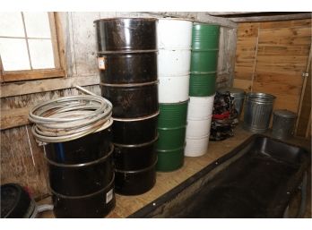 HUGE LOT OF 55 GALLON DRUMS, ROLLERS AND METAL CANS