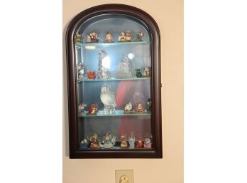 WALL DISPLAY CASE WITH FIGURES AND ITEMS INSIDE IT