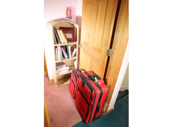 2 RED LUGGAGE AND STAND UP DISPLAY WITH BOOKS.  ENTIRE LOT