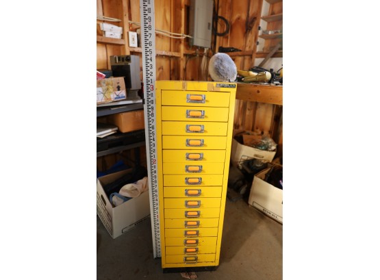 YELLOW VINTAGE METAL DRAWER UNIT WITH ITEMS INSIDE