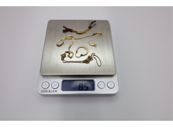 8.51 GRAMS 14K MARKED GOLD WITH UNMARKED DENTAL GOLD FOR A TOTAL OF 8.51 GRAMS