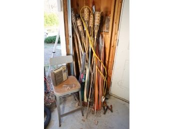 GARAGE CORNER LOT WITH TIKI TORCHES AND OTHER THINGS SHOWN