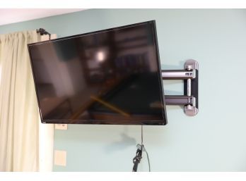 TV AND WALL MOUNT IN BASEMENT (BUYER TO SAFELY REMOVE)