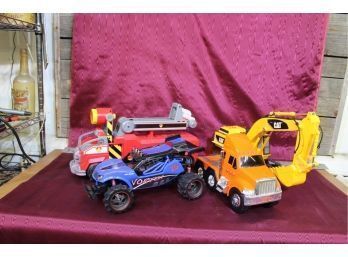 4 Battery Operable Toys Race Car, Fire Truck, Cab Of Tractor Trailer, Cat Backhoe. See Pictures For Details