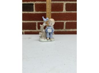 SMALL PORCELAIN BOY AND BIRDS 5 INCH