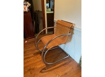 VINTAGE WICKER CHAIR WITH CHROME LEGS, GOOD CONDITION.