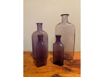 LOT OF 4 PURPLE GLASS BOTTLES COLORED