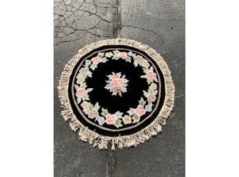 HAND MADE IN CHINA ROUND BLACK AND FLOWER PATTERN RUG,  37IN DIAMETER