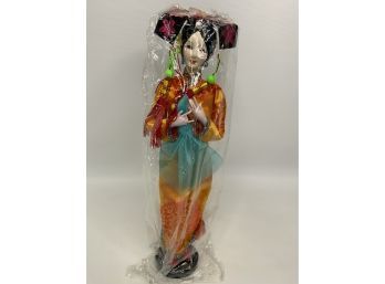 ASIAN STYLE DOLL WITH ORANGE DRESS. BRAND  NEW