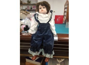 Porcelain Doll Dressed In Blue Jumper With White Shirt