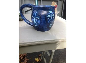 Handmade By Artist .. Blue Pitcher With Faces Around It