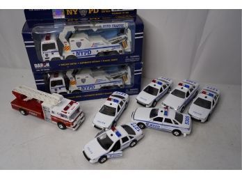 LARGE LOT OF NYPD TOY CARS AND 1 FDNY FIRE TRUCK