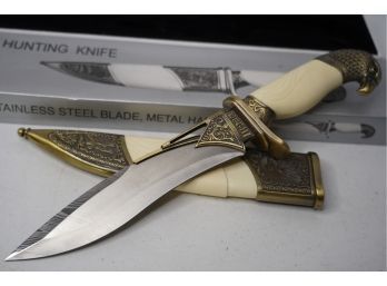 LIKE NEW HUNTING KNIFE WITH BRASS ENGRAVINGS